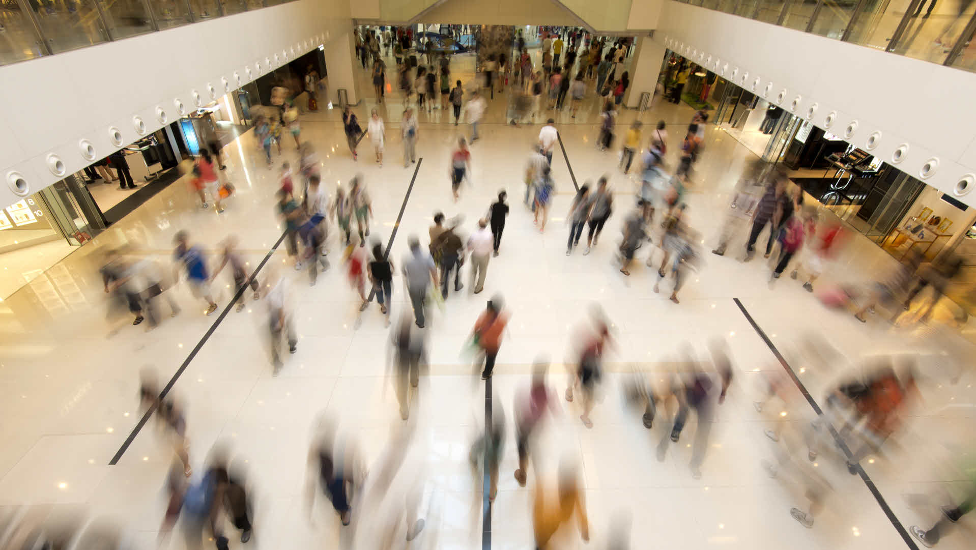 Stock image of blurred shopper mall