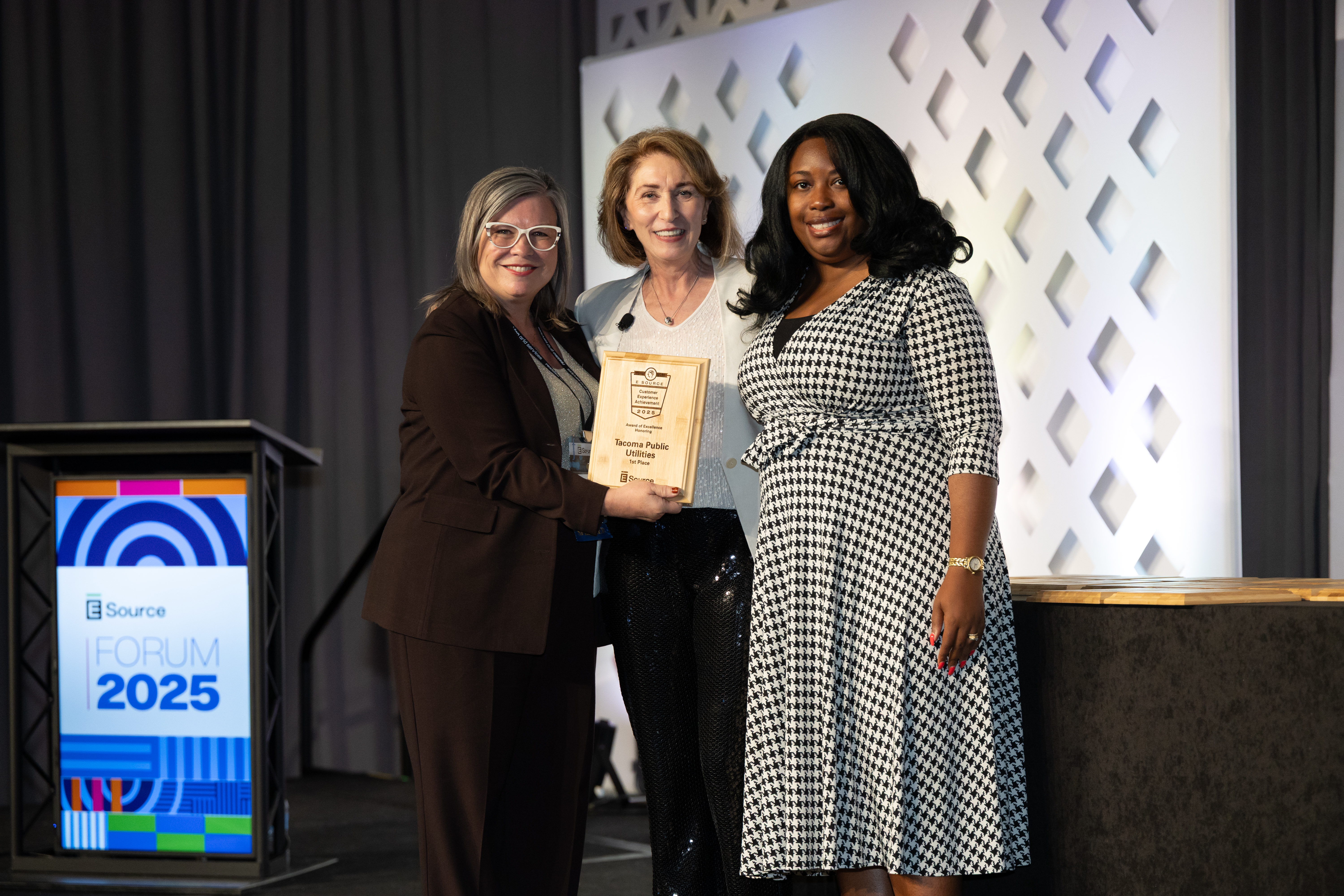 Winners accepting award for the 2025 achievement in customer experience.